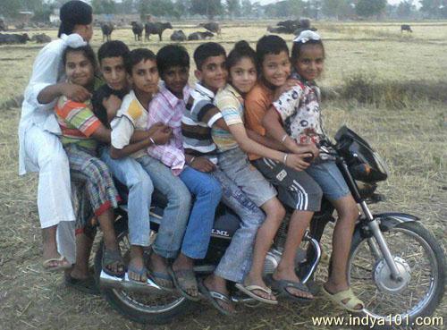 9 CHILDREN ON BIKE