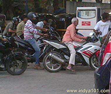 old man riding yamaha bike